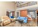 Open floor plan showcasing a living room with high ceilings and access to the staircase and kitchen at 18967 Mill Grove Dr, Noblesville, IN 46062