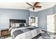 Spacious primary bedroom with a large bed and neutral decor at 18967 Mill Grove Dr, Noblesville, IN 46062