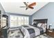 Spacious bedroom offers natural light, ceiling fan, and neutral walls at 18967 Mill Grove Dr, Noblesville, IN 46062