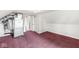 Finished attic space with red carpet and utility equipment, offering versatile usage options at 20530 Victory Chapel Rd, Noblesville, IN 46060