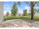 Home featuring a concrete patio with decorative rock and a well-maintained lawn at 20530 Victory Chapel Rd, Noblesville, IN 46060