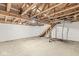 Unfinished basement with exposed ceiling beams and concrete floor provides ample storage space at 20530 Victory Chapel Rd, Noblesville, IN 46060