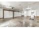 Spacious two-car garage with white doors, ample room for storage, and utility access, perfect for vehicle parking or workshop at 20530 Victory Chapel Rd, Noblesville, IN 46060