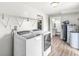 Spacious laundry room with washer, dryer, and water heater at 20530 Victory Chapel Rd, Noblesville, IN 46060