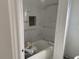Bathroom featuring a tub and stylish tiled walls, awaiting final installations at 243 Iowa St, Indianapolis, IN 46225