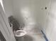 Bright bathroom featuring new white toilet and marble flooring, ready for finishing touches at 243 Iowa St, Indianapolis, IN 46225