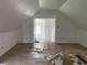 Bright bedroom featuring neutral walls, wooden floors, and a doorway leading to another room at 243 Iowa St, Indianapolis, IN 46225