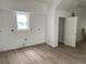 Bright living room featuring neutral walls, wooden floors, and a window for light at 243 Iowa St, Indianapolis, IN 46225