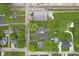 Overhead view of property, including a well-kept lawn, garage, and surrounding neighborhood at 30 N Depot St, New Palestine, IN 46163