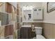 A charming bathroom features a vanity with gray wood and a shower with a decorative curtain at 30 N Depot St, New Palestine, IN 46163