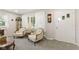 Cozy living room features a bright window, neutral colors, and quaint decor at 30 N Depot St, New Palestine, IN 46163