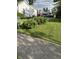 Spacious backyard with lush green grass and well-maintained landscaping at 303 Walnut St, Greenfield, IN 46140