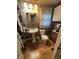 Compact bathroom featuring a pedestal sink, and classic fixtures at 303 Walnut St, Greenfield, IN 46140