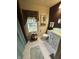 Bathroom with natural light, decorative vanity, and modern fixtures, offering a clean and comfortable space at 303 Walnut St, Greenfield, IN 46140