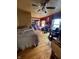 Bright bedroom featuring hardwood floors and a ceiling fan at 303 Walnut St, Greenfield, IN 46140