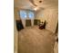 Cozy bedroom featuring neutral walls, natural lighting, and carpeted floors at 303 Walnut St, Greenfield, IN 46140