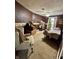 Inviting bedroom with plush armchair, wood floors, and decorative accents, cozy and bright at 303 Walnut St, Greenfield, IN 46140