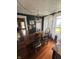 Bright dining room with chandelier, wood floors, and large windows, offering natural light at 303 Walnut St, Greenfield, IN 46140