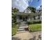 Charming home with a cozy front porch, landscaped yard, and inviting curb appeal at 303 Walnut St, Greenfield, IN 46140