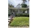 Inviting two-story home with a cozy covered porch and landscaped front yard at 303 Walnut St, Greenfield, IN 46140