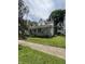 Charming two-story home with a covered porch and well-maintained lawn at 303 Walnut St, Greenfield, IN 46140
