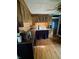 This cozy kitchen includes a unique sink, wood floors and cabinets, and a vintage feel at 303 Walnut St, Greenfield, IN 46140