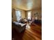 Cozy living room featuring classic furniture, hardwood floors, and bright natural light at 303 Walnut St, Greenfield, IN 46140