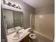 Bathroom with tub and shower, sink and vanity, mirror and lighting at 356 Seabreeze Cir, Avon, IN 46123