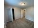 A bright bedroom featuring a light-colored wall and carpeted flooring at 356 Seabreeze Cir, Avon, IN 46123