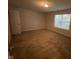 A bedroom with neutral walls, carpet, and a window offering natural light at 356 Seabreeze Cir, Avon, IN 46123