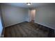 Bedroom with carpet and neutral walls, window for natural light, and door into hall at 356 Seabreeze Cir, Avon, IN 46123