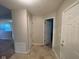 Inviting entryway with tile flooring offers a glimpse into the living area; neutral paint color throughout at 356 Seabreeze Cir, Avon, IN 46123