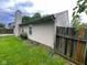 Side view of the home displays the exterior siding, fencing, landscaping and outdoor space at 356 Seabreeze Cir, Avon, IN 46123