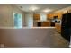 Kitchen area features oak cabinets, black appliances, vinyl flooring and sliding glass doors to outdoor patio at 356 Seabreeze Cir, Avon, IN 46123