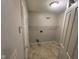 Convenient laundry room features tile floors, utility connections, and overhead storage shelf for easy organization at 356 Seabreeze Cir, Avon, IN 46123