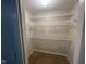 Spacious walk-in closet features carpeted flooring and multiple, adjustable wire shelves for optimal storage at 356 Seabreeze Cir, Avon, IN 46123