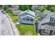 An elevated view of a gray home with a front yard, positioned in a quiet neighborhood at 3636 Crescent Ave, Indianapolis, IN 46208