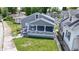 A high-angle view shows the house and a neatly kept yard in a residential neighborhood at 3636 Crescent Ave, Indianapolis, IN 46208