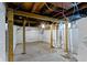 Unfinished basement with a concrete floor, block walls painted white, and exposed ceiling beams at 3636 Crescent Ave, Indianapolis, IN 46208