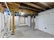 Unfinished basement with a concrete floor, block walls painted white, and exposed ceiling beams at 3636 Crescent Ave, Indianapolis, IN 46208