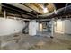 Unfinished basement with a concrete floor, block walls painted white, and exposed ceiling beams at 3636 Crescent Ave, Indianapolis, IN 46208