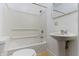 Full bathroom features a pedestal sink, toilet, shower, and tiled floor at 3636 Crescent Ave, Indianapolis, IN 46208