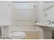 This is a full bathroom with a pedestal sink, toilet, shower, and tile floor at 3636 Crescent Ave, Indianapolis, IN 46208