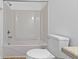 Bright bathroom with a combined tub and shower, toilet, and tile flooring at 3636 Crescent Ave, Indianapolis, IN 46208