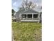 Charming home featuring gray siding, a covered porch with white columns and stone accents at 3636 Crescent Ave, Indianapolis, IN 46208