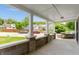 View of covered front porch with brick base and white columns providing outdoor living space at 3636 Crescent Ave, Indianapolis, IN 46208