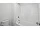 Bathroom featuring shower/tub combo and white tiled walls at 3931 Wren Dr, Brownsburg, IN 46112