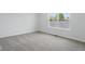 Bedroom featuring plush carpet and natural light from the two windows at 3931 Wren Dr, Brownsburg, IN 46112