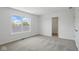 Bright bedroom featuring a large window, closet, and neutral carpet at 3931 Wren Dr, Brownsburg, IN 46112