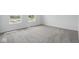 A bright bedroom with neutral carpet and two windows letting in natural light at 3931 Wren Dr, Brownsburg, IN 46112